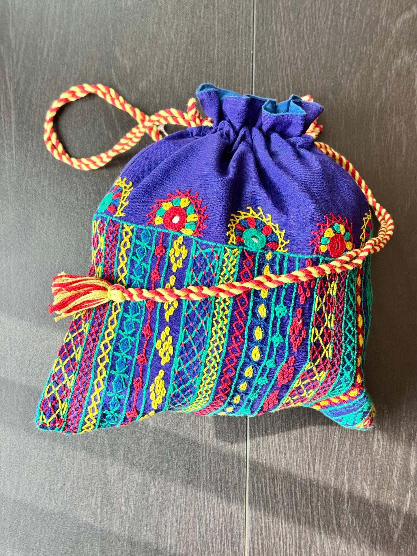 Blue potli bag with intricate Lambani embroidery work