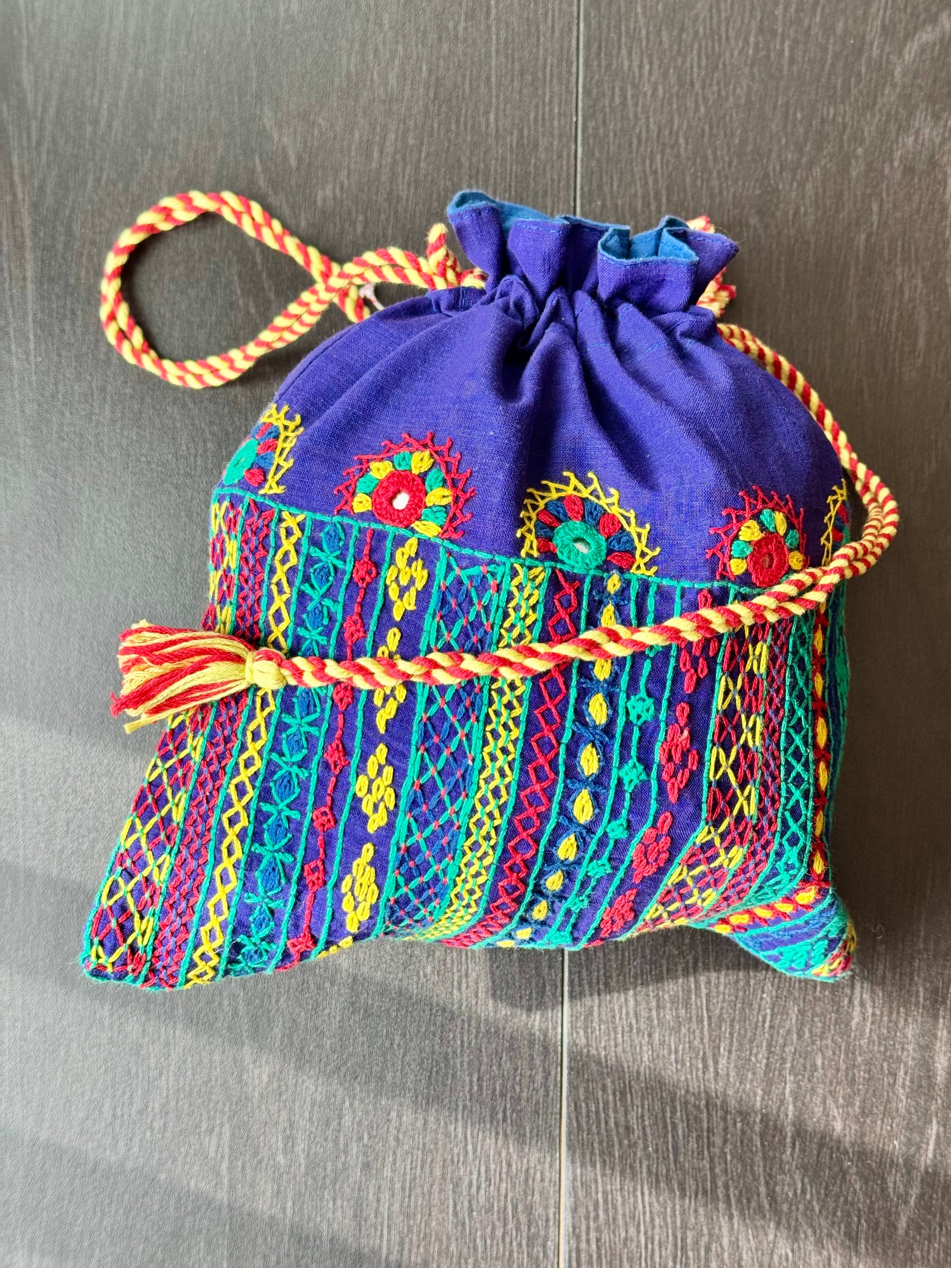 Blue potli bag with intricate Lambani embroidery work