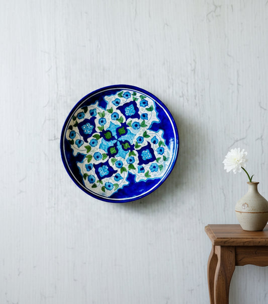 Handcrafted Jaipur Blue Pottery plates, featuring intricate designs and vibrant blue hues, adding a traditional Indian touch to your home decor.