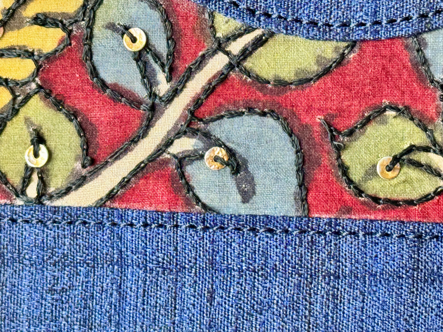 Close up of blue raw silk hand painted Kalamkari clutch bag