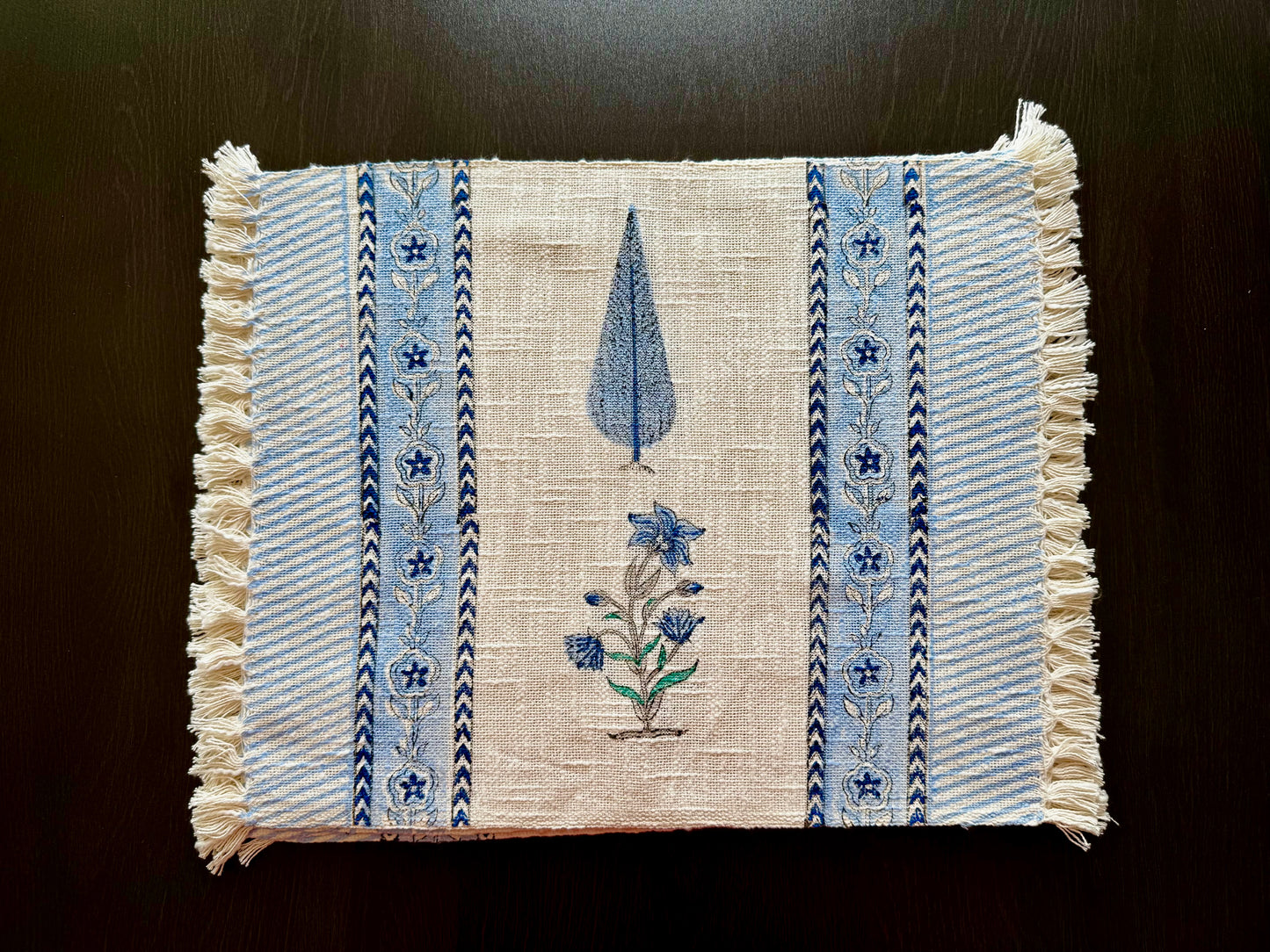 Placemats with blue floral hand block print  on a dark background