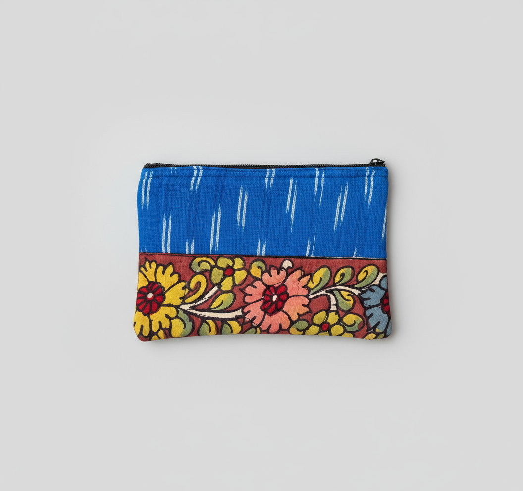 Colorful floral-patterned pouch with blue top section on a gray background