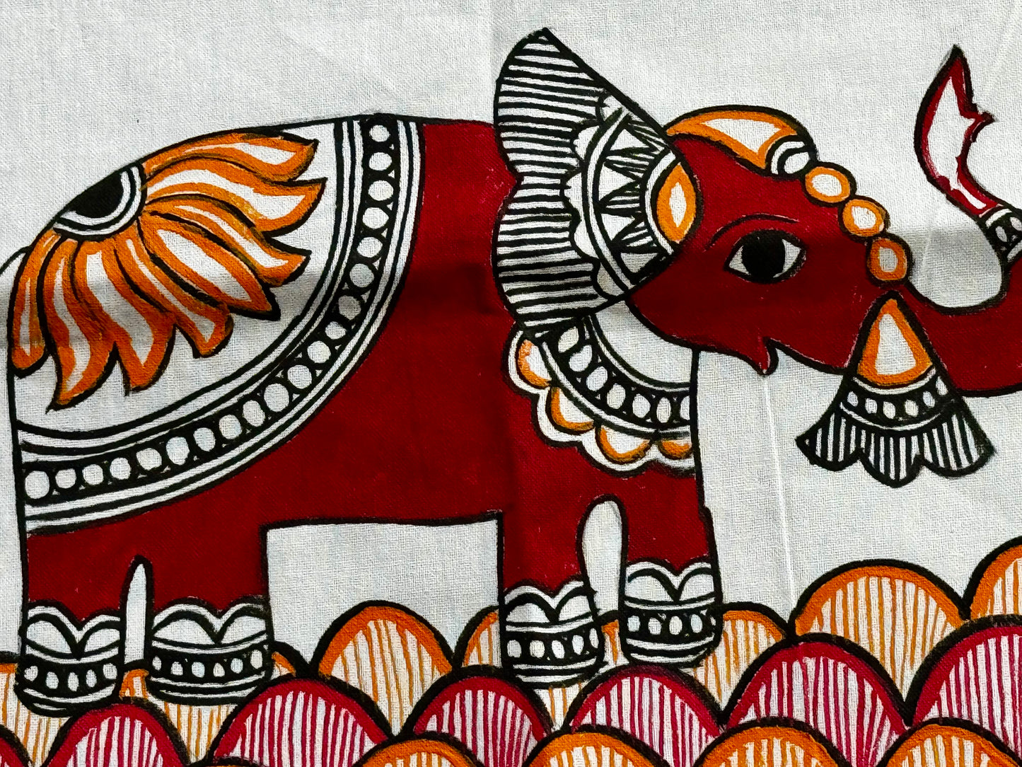 Decorative illustration of an elephant with intricate patterns on a white background