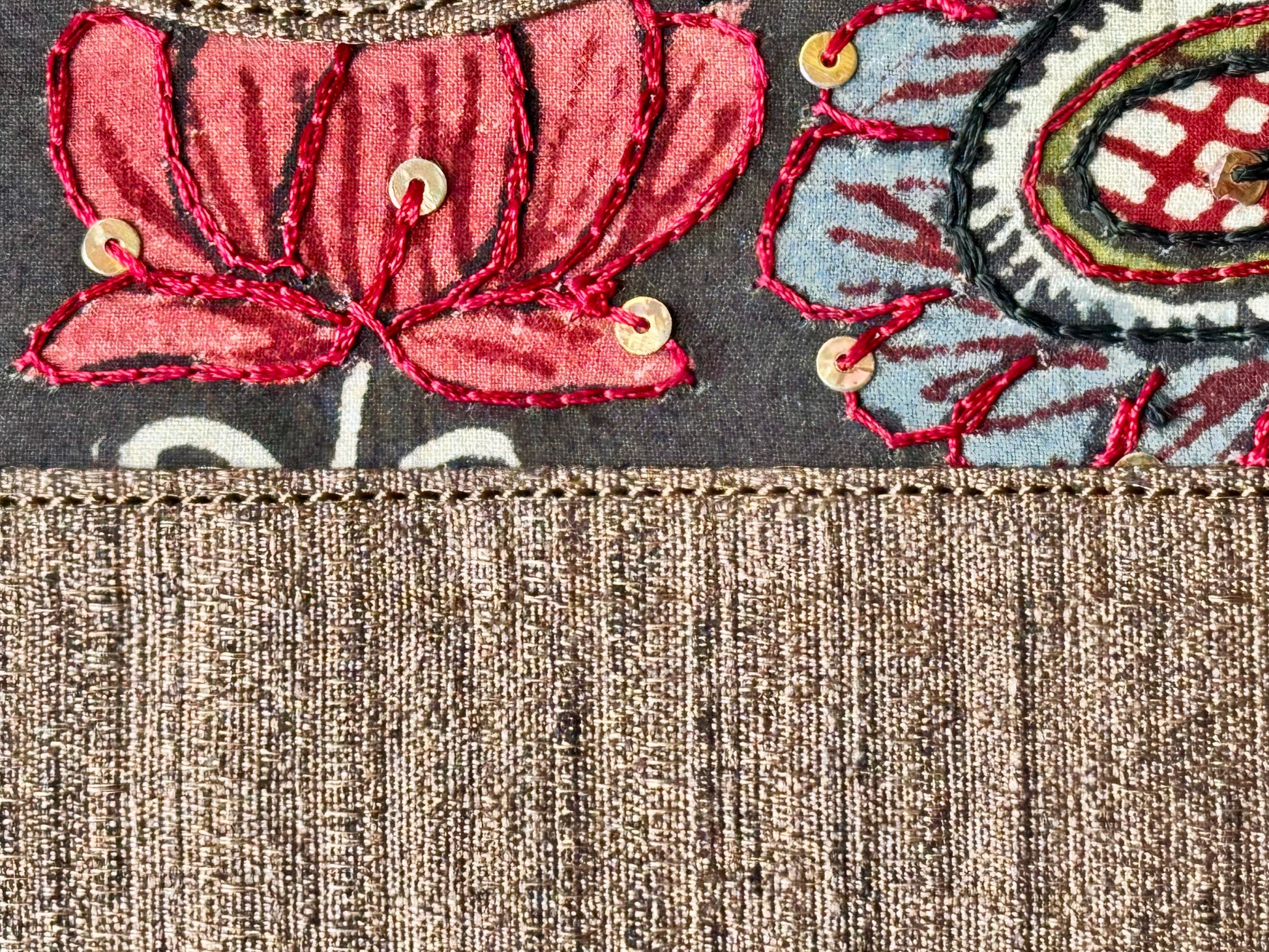 Close up of black raw silk hand painted Kalamkari clutch bag