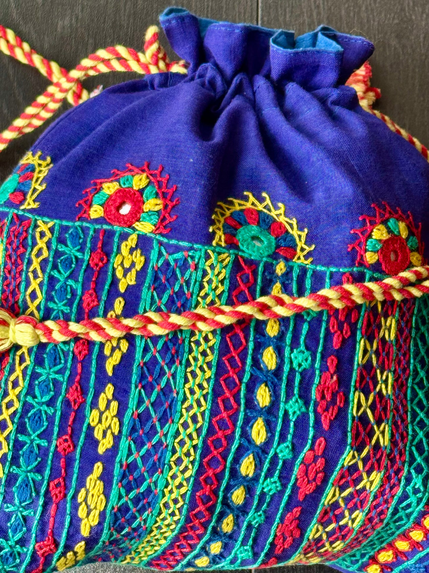 Blue potli bag with intricate Lambani embroidery work