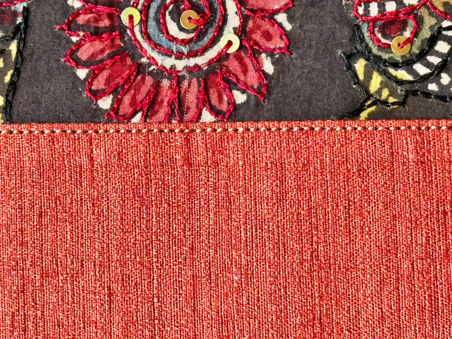 Close up of coral hand painted Kalamkari bag