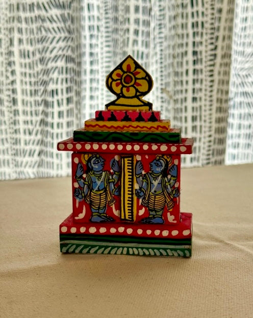 Colorful decorative item with artistic design on a neutral background