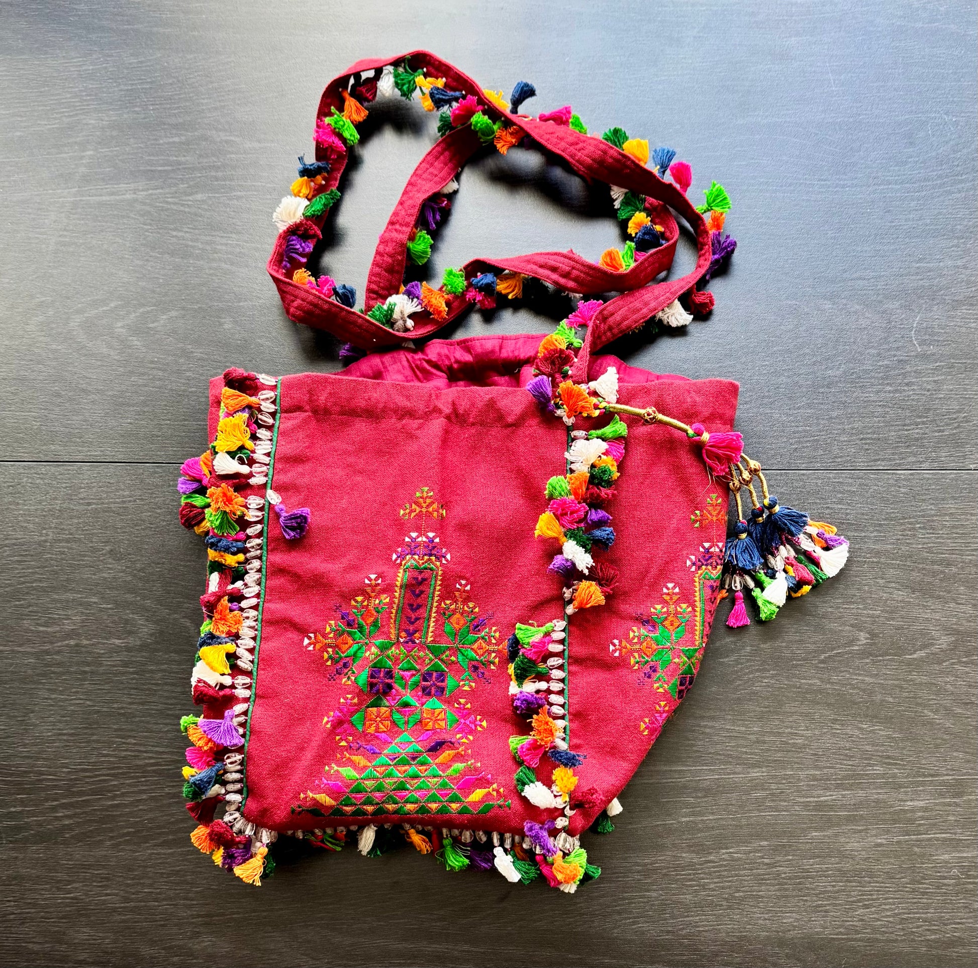 Crimson Kutchi Soof embroidery batwa with embroidered panels and tassel trim