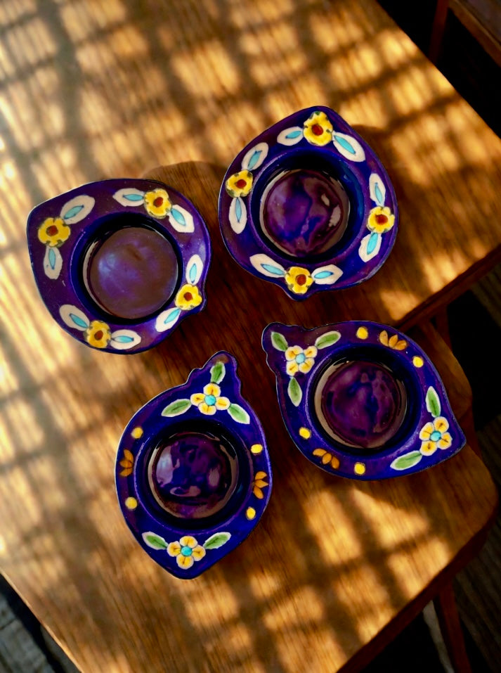 Handcrafted Jaipur Blue Pottery tea light holders, featuring intricate designs and vibrant blue hues, adding a traditional Indian touch to your home decor.