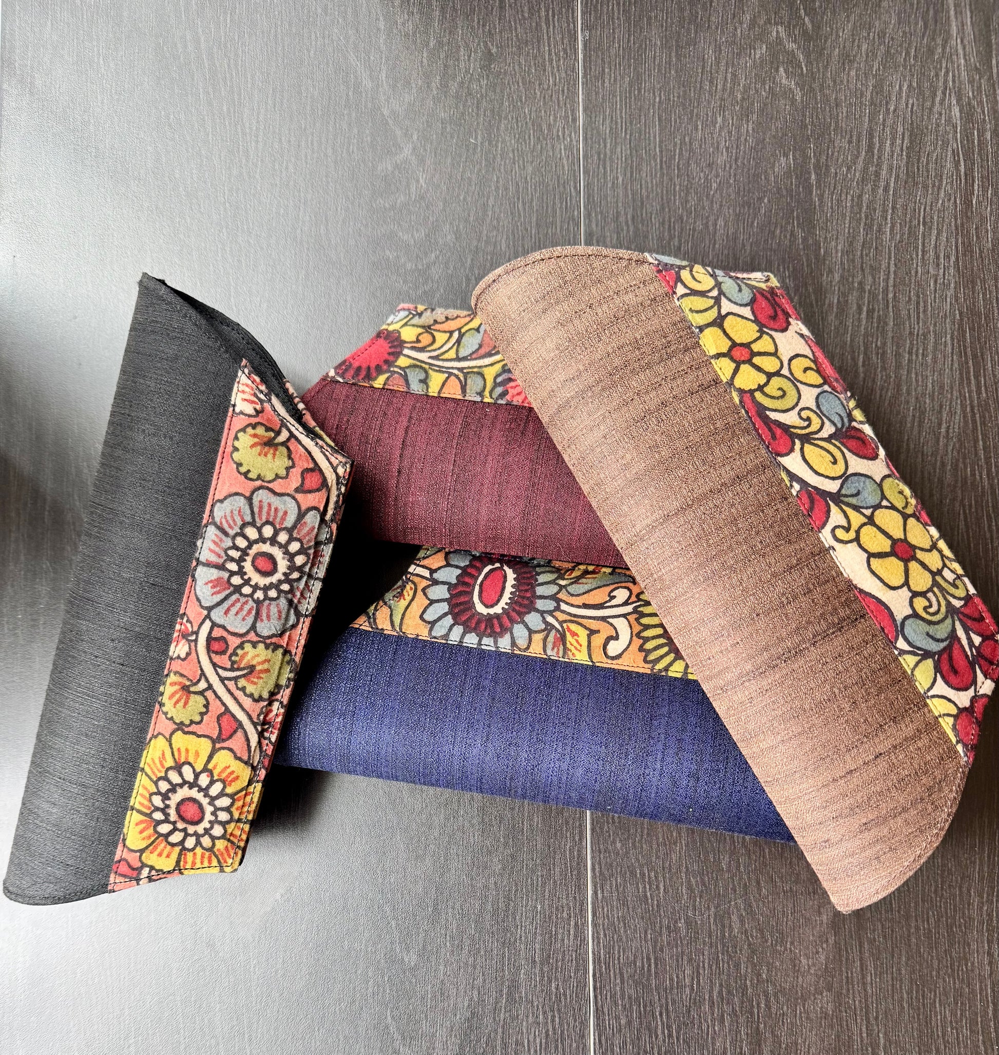 Four clutch bags in hand painted Kalamkari patterns