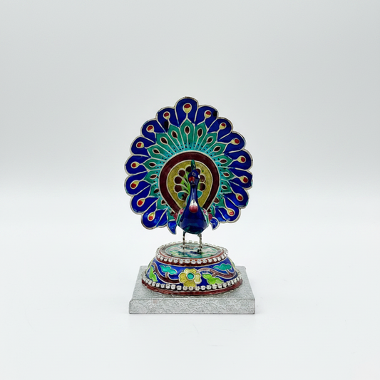 Decorative Gulabi Meenakari silver peacock figure on a white background