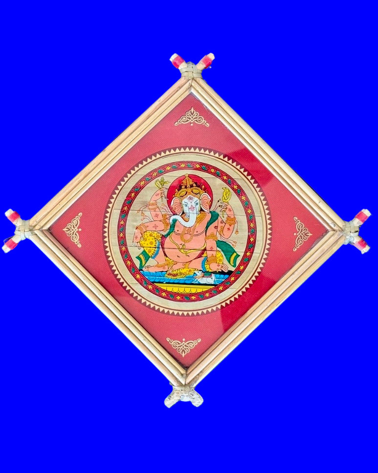 Decorative wall art with a central figure in a red frame on a blue background