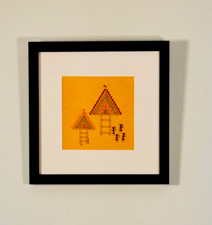 Framed artwork with geometric design on a yellow background