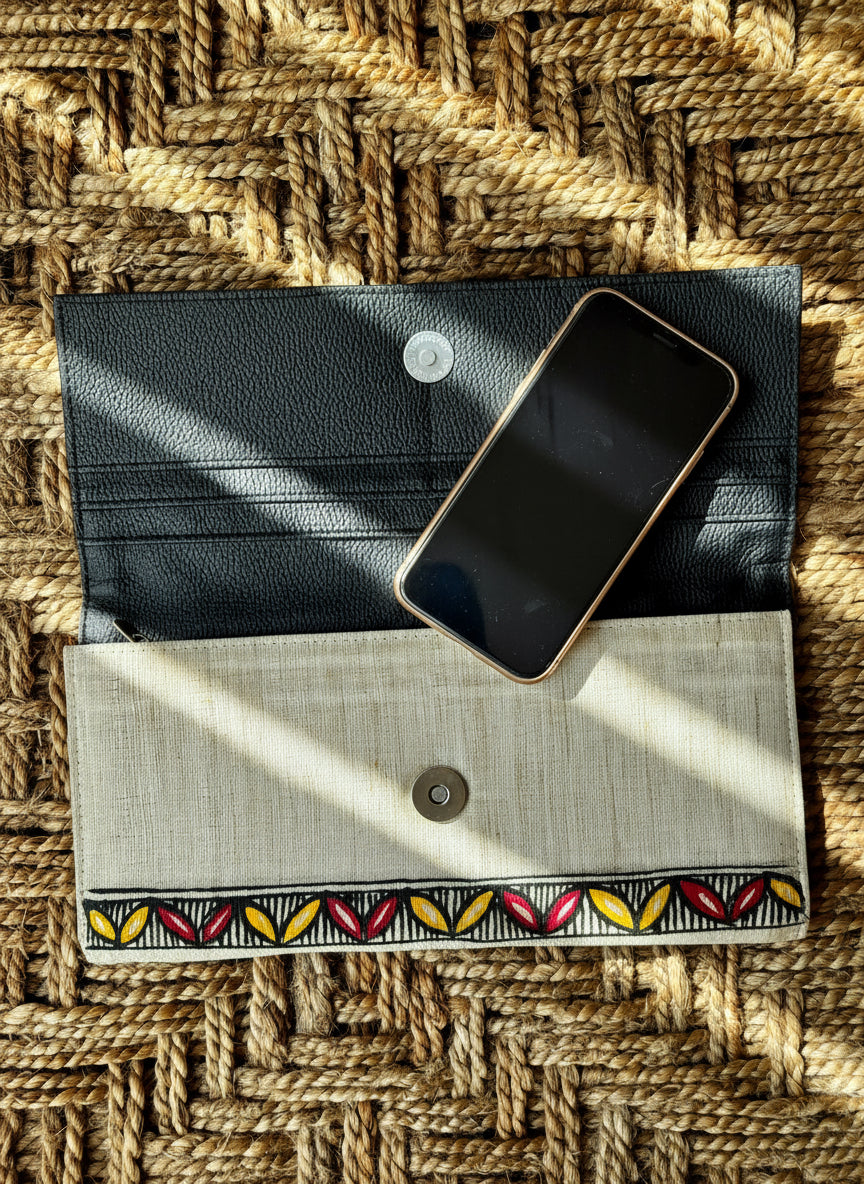 Madhubani hand painted gray wallet, black design on a woven mat