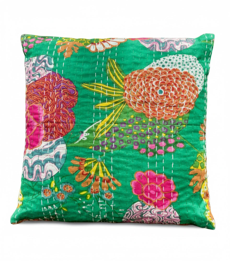 Colorful floral-patterned pillow on a dark surface