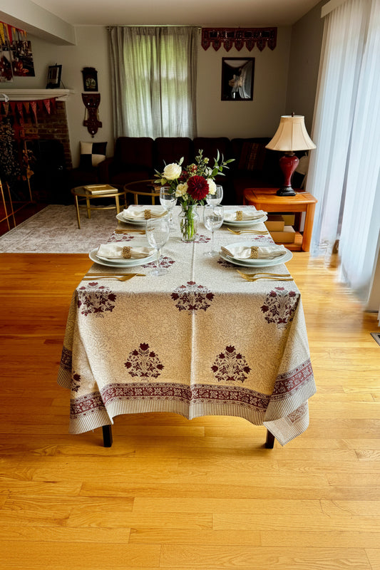 Living room with a table covered by a patterned hand block printed tablecloth