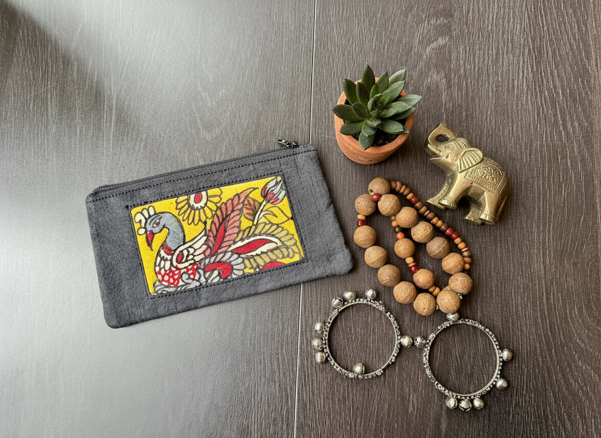 Kalamkari hand painted peacock on yellow background on black make up pouch