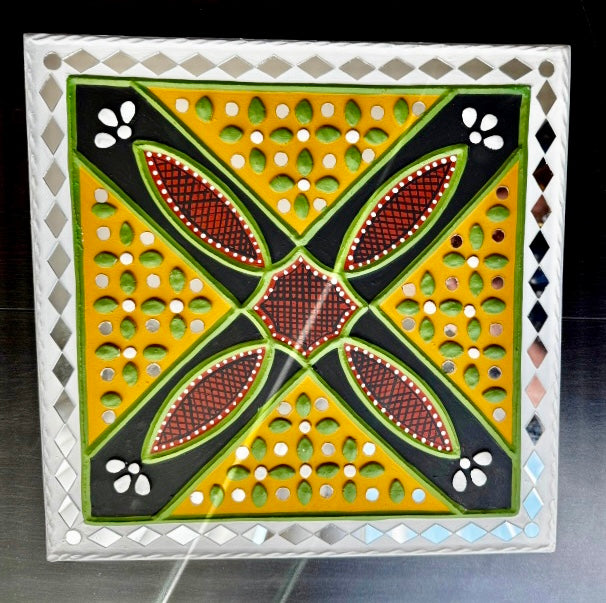Decorative tile with geometric pattern on a stand