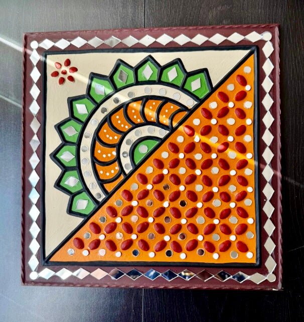 Decorative wall art with geometric pattern on a dark surface