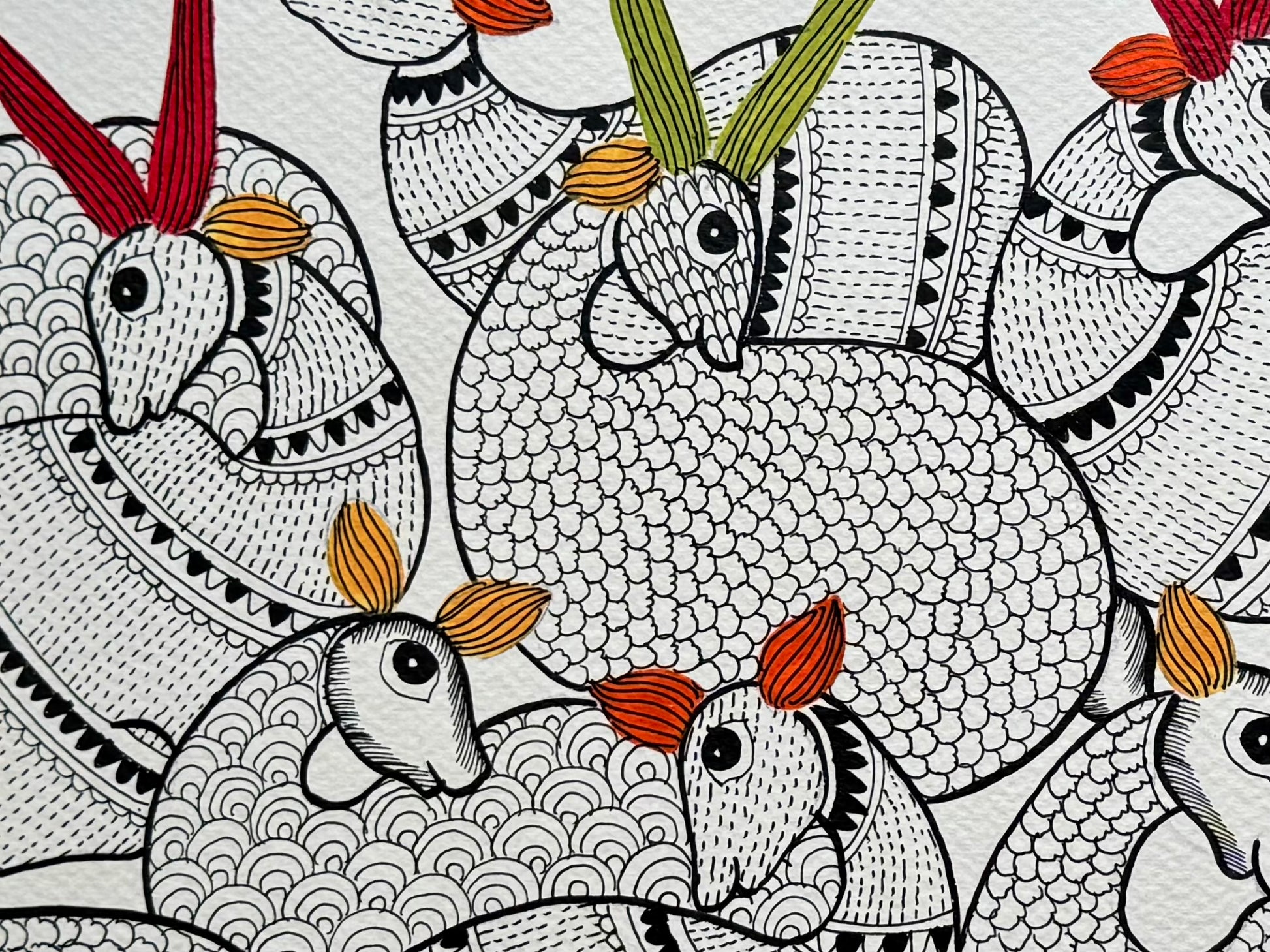 Close up of Gaond art painting of animals with red and yellow accents on a white background