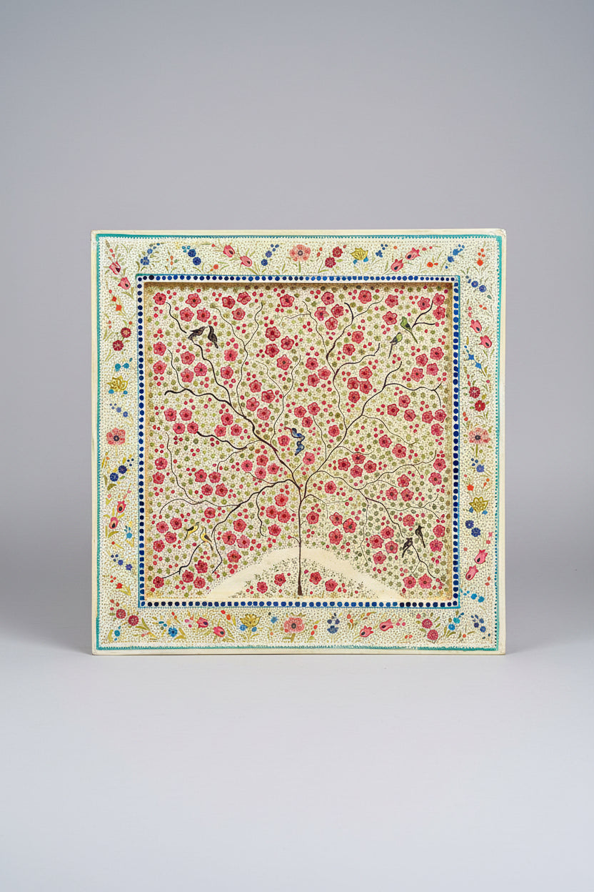 Kashmiri paper Mache decorative square tray with floral design and border on a dark background 