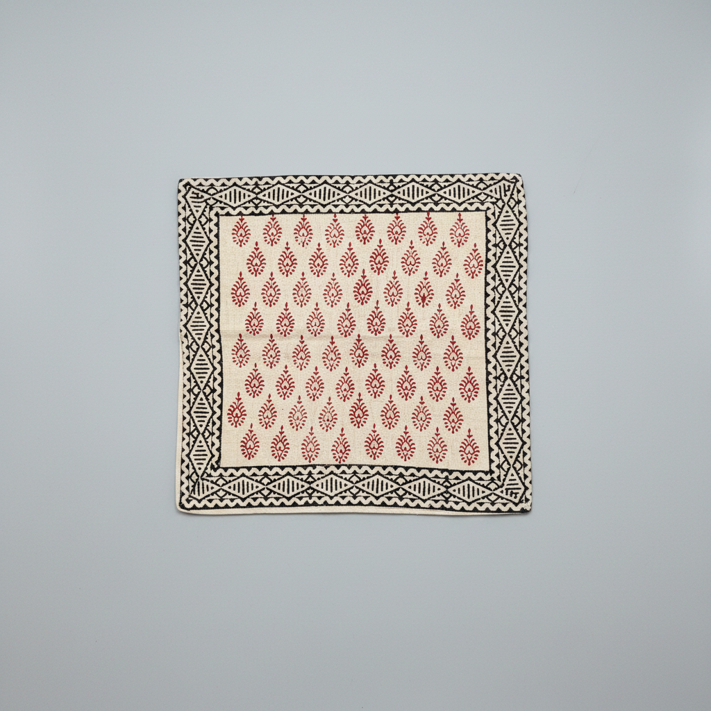 Bagru hand block print cushion cover  with red and black pattern on a gray background