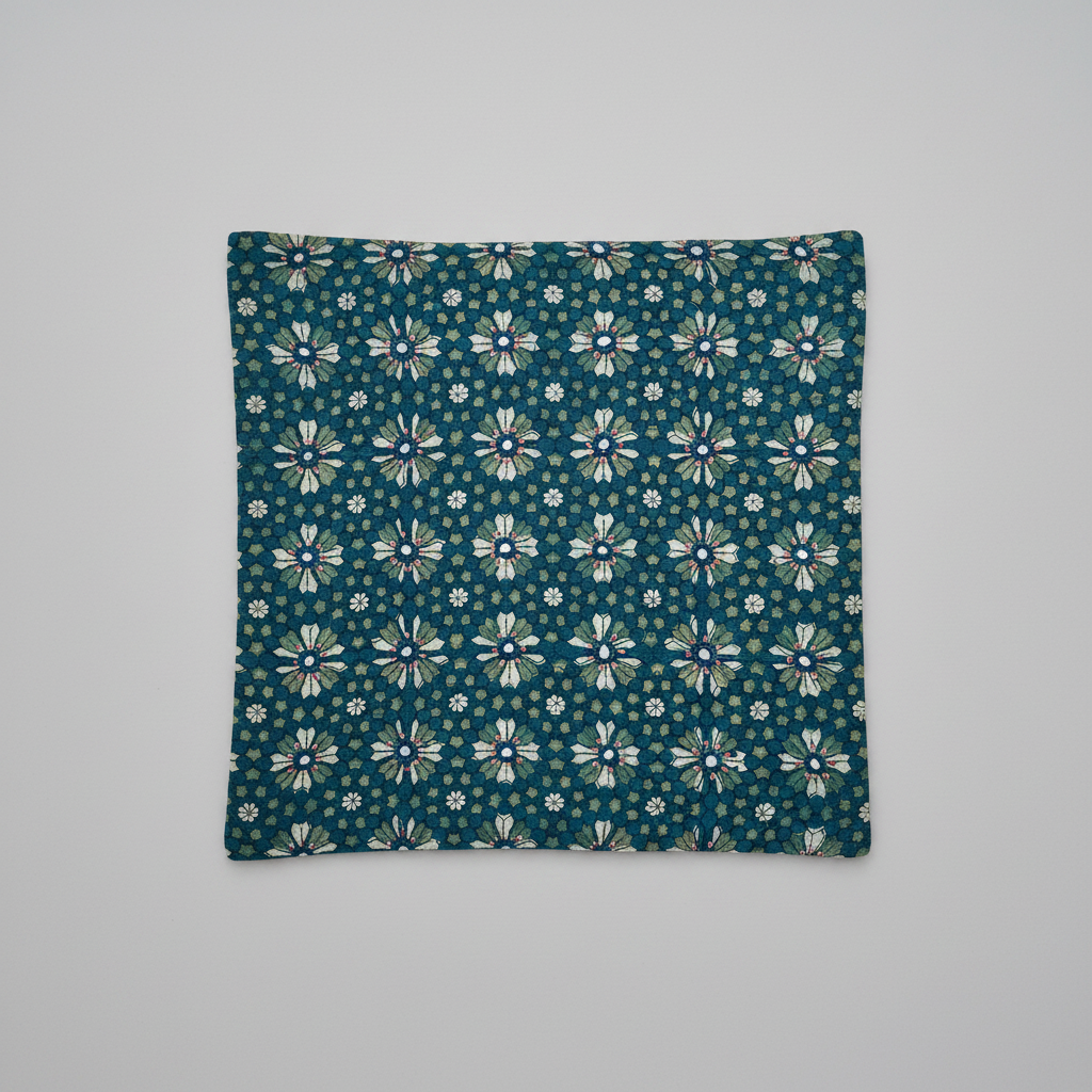Hand block printed Floral patterned square cushion cover on a gray background