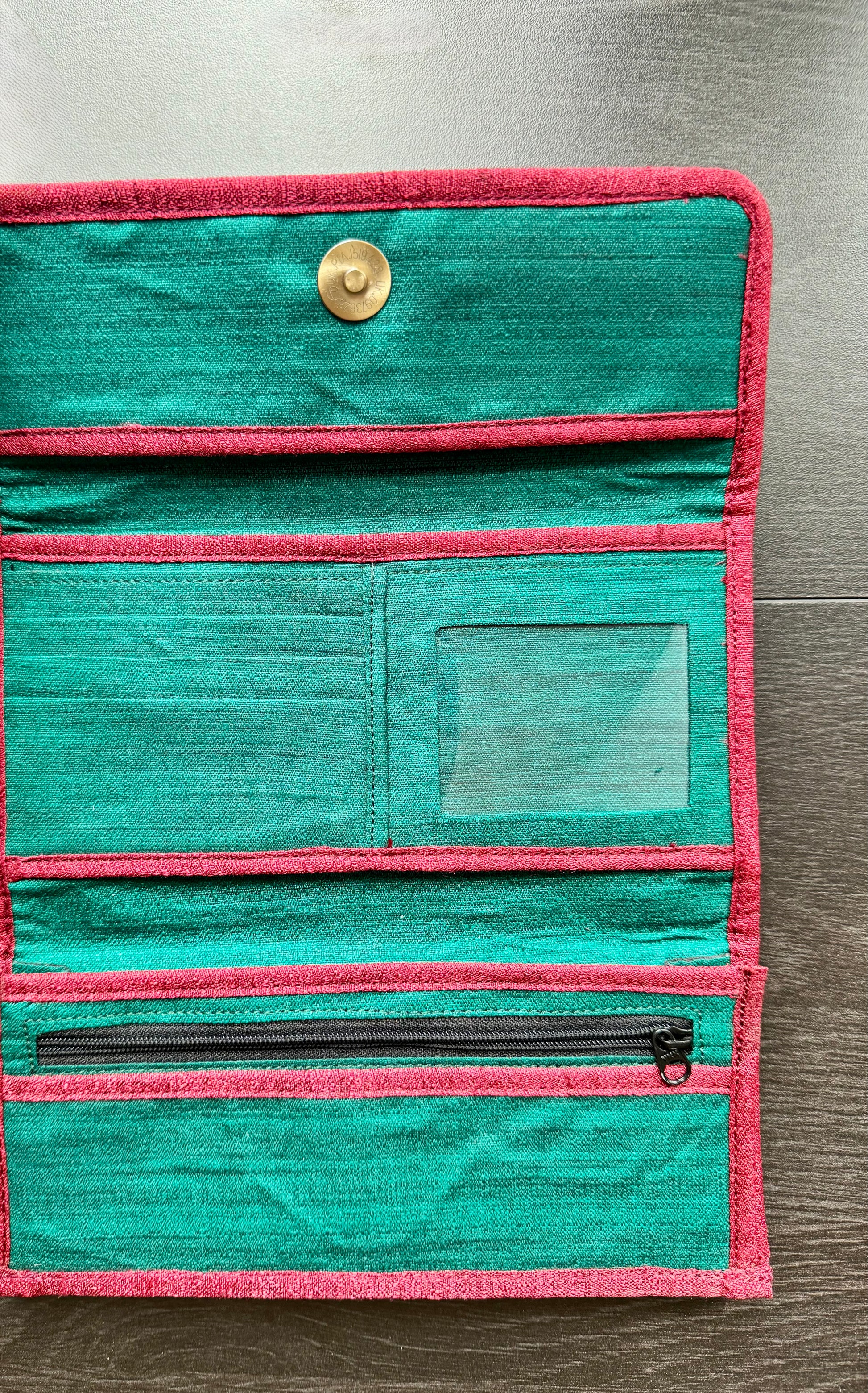 Authentic Kalamkari fabric evening clutch featuring vibrant hand-painted Indian motifs and artisanal detailing. Showing the inside of the clutch