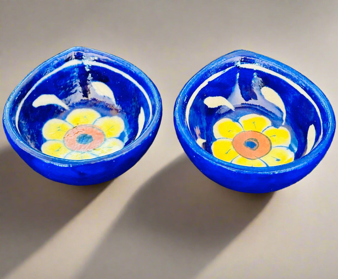 Handcrafted Jaipur Blue Pottery diyas, featuring intricate patterns and vibrant blue tones, perfect for adding a traditional Indian touch to your festive celebrations.