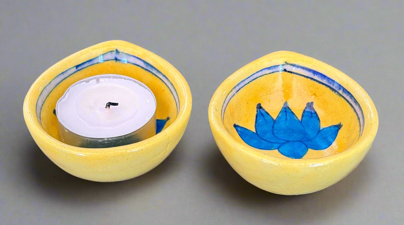 Handcrafted Jaipur Blue Pottery diyas, featuring intricate patterns and vibrant blue tones, perfect for adding a traditional Indian touch to your festive celebrations.