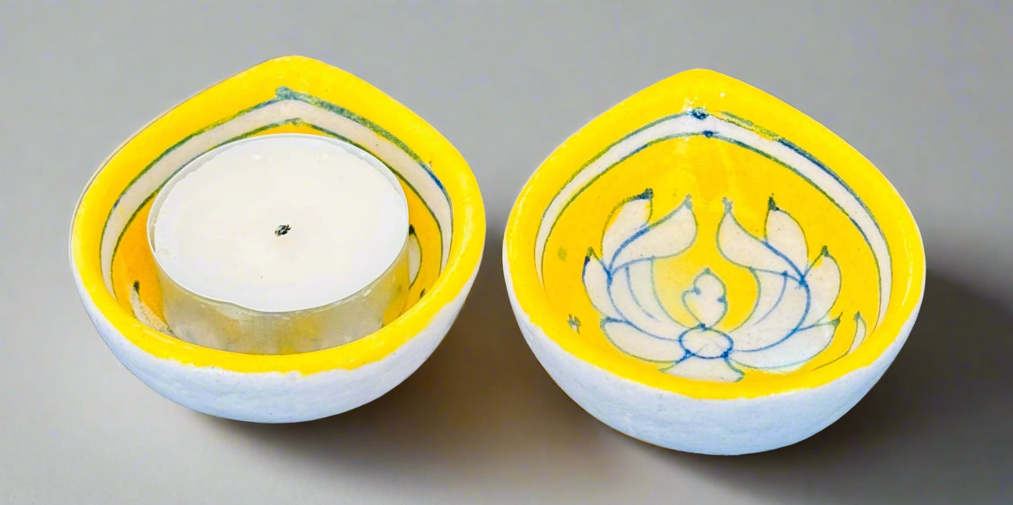 Handcrafted and Jaipur Blue Pottery diyas, featuring intricate patterns and vibrant blue tones, perfect for adding a traditional Indian touch to your festive celebrations.