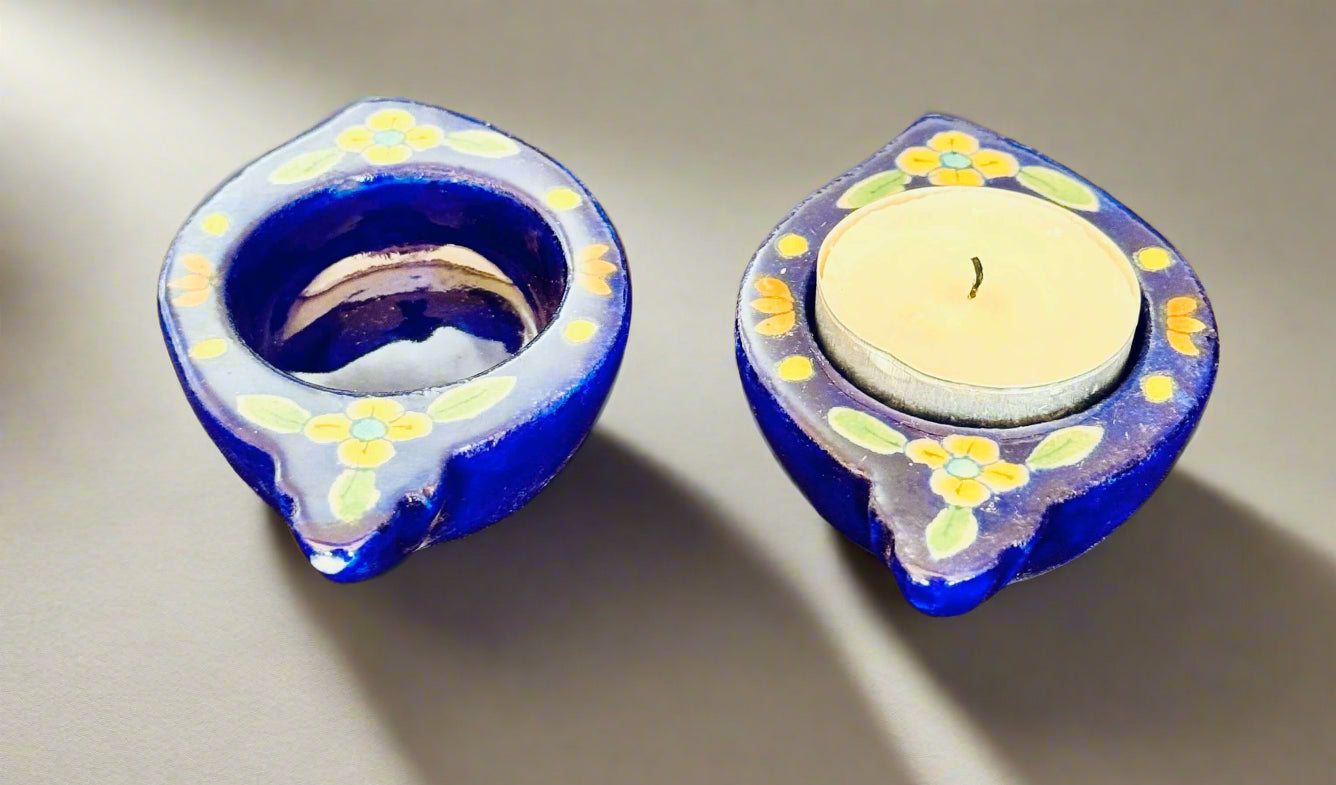 Handcrafted Jaipur Blue Pottery tea light holders, featuring intricate designs and vibrant blue hues, adding a traditional Indian touch to your home decor.