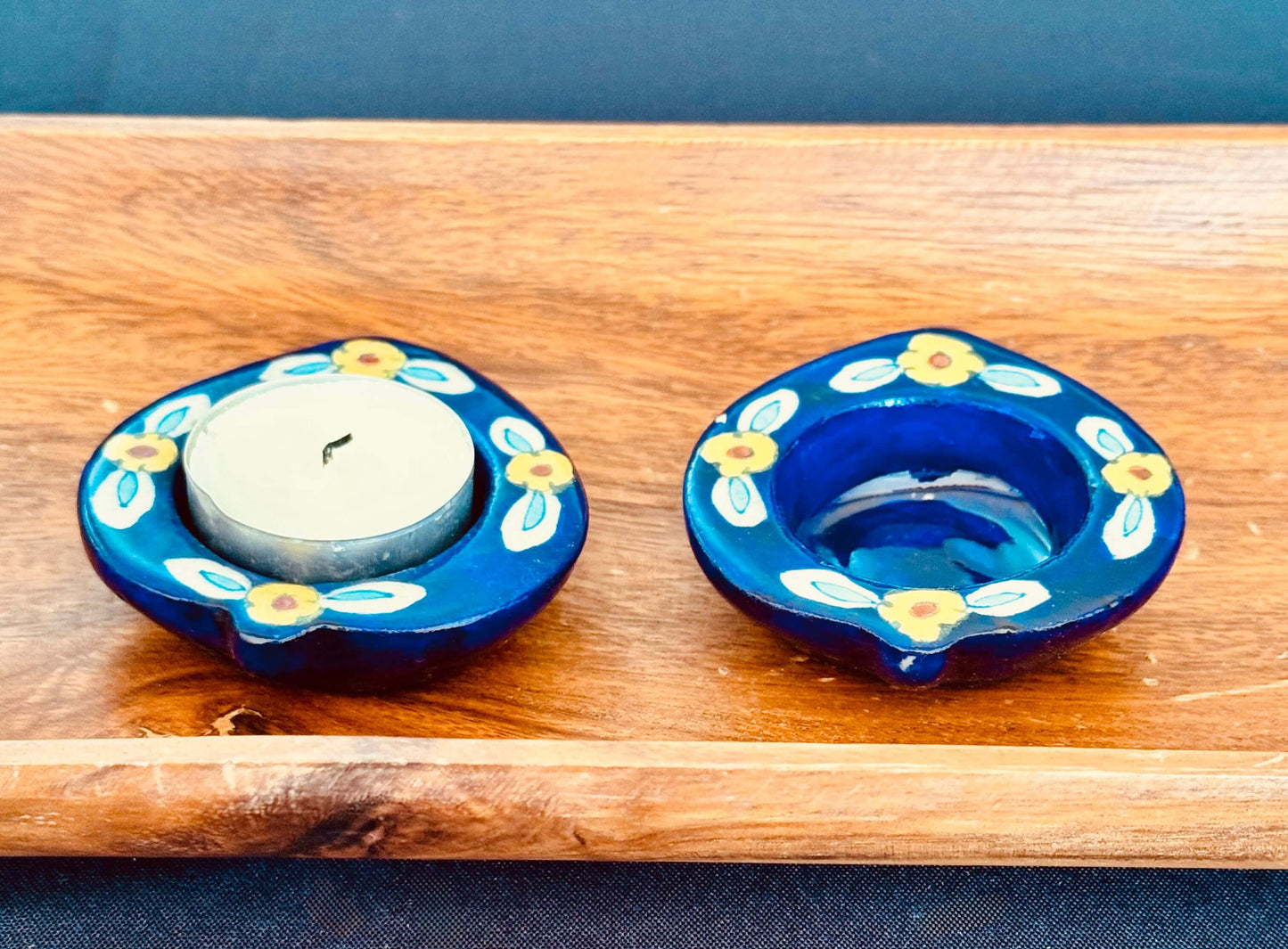 Handcrafted Jaipur Blue Pottery tea light holders, featuring intricate designs and vibrant blue hues, adding a traditional Indian touch to your home decor.
