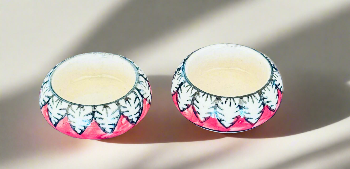 Handcrafted Jaipur Blue Pottery tea light holders, featuring intricate designs and vibrant blue hues, adding a traditional Indian touch to your home decor.