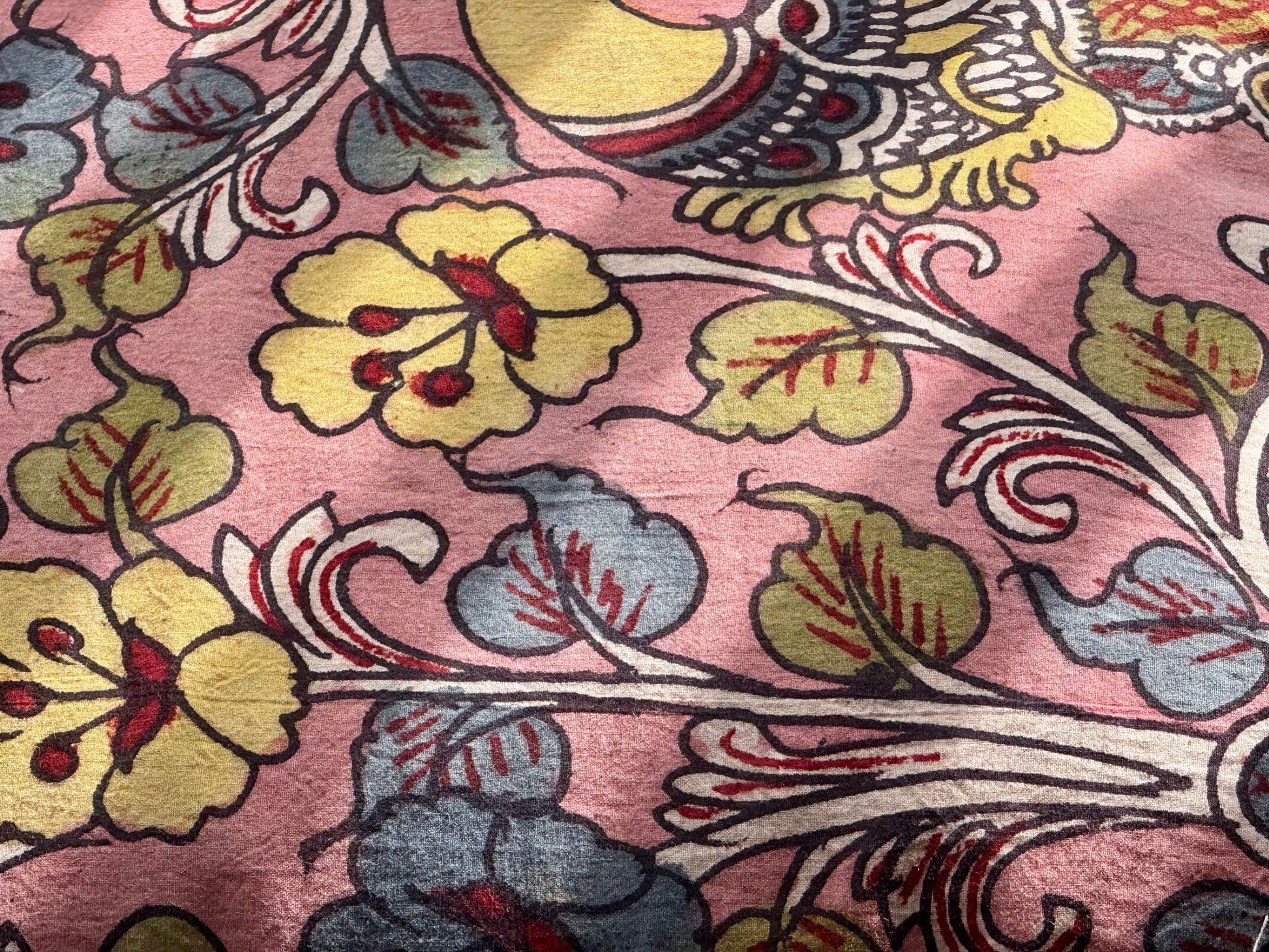 Close-up of floral patterned fabric with pink background