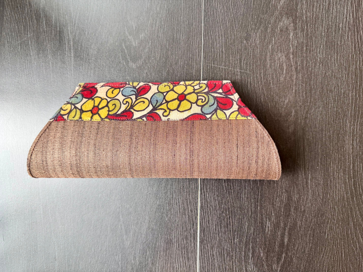 Brown raw silk clutch bag with hand painted Kalamkari pattern border