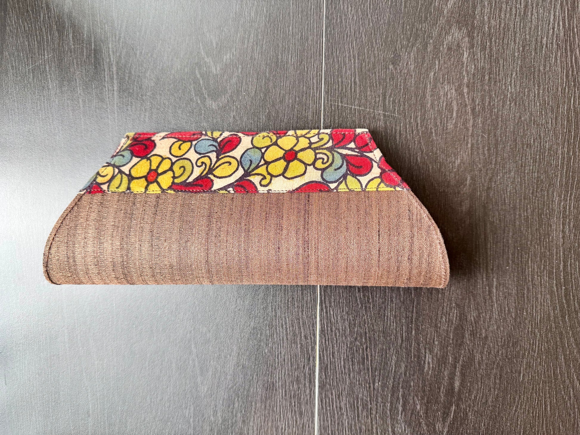 Brown raw silk clutch bag with hand painted Kalamkari pattern border