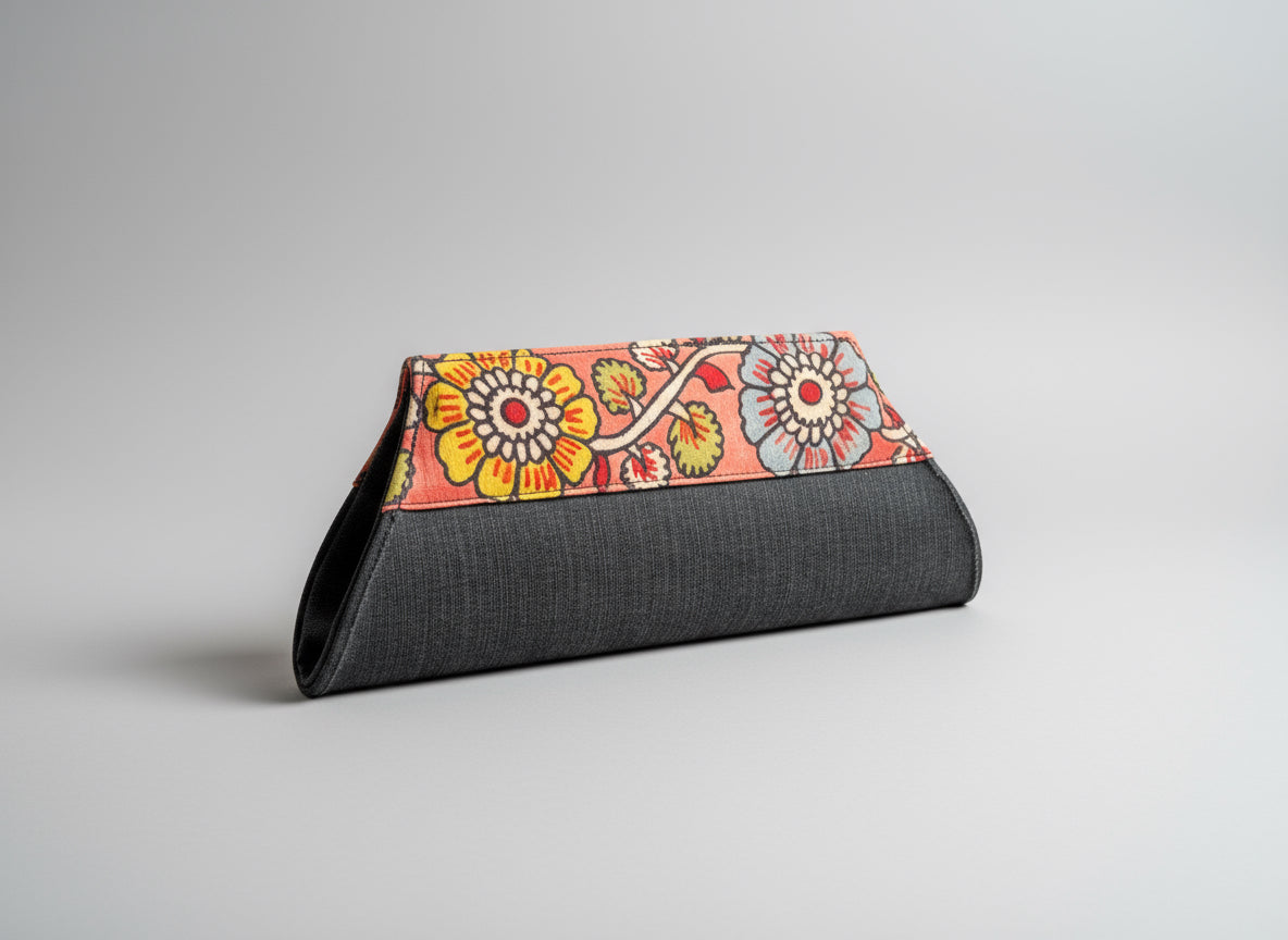 A collection of hand-painted kalamkari clutch purses in various colors, featuring intricate patterns.
