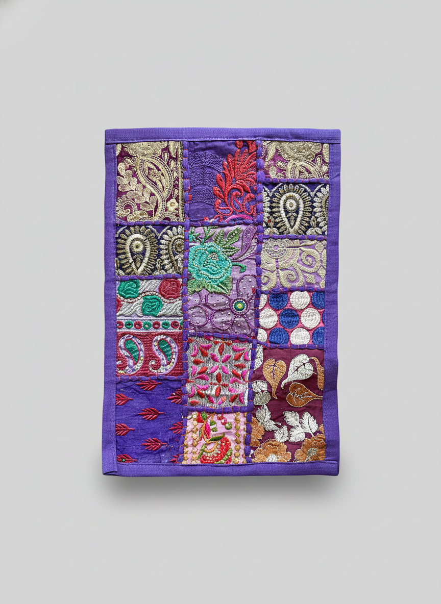 Purple embroidered fabric patchwork on a gray background