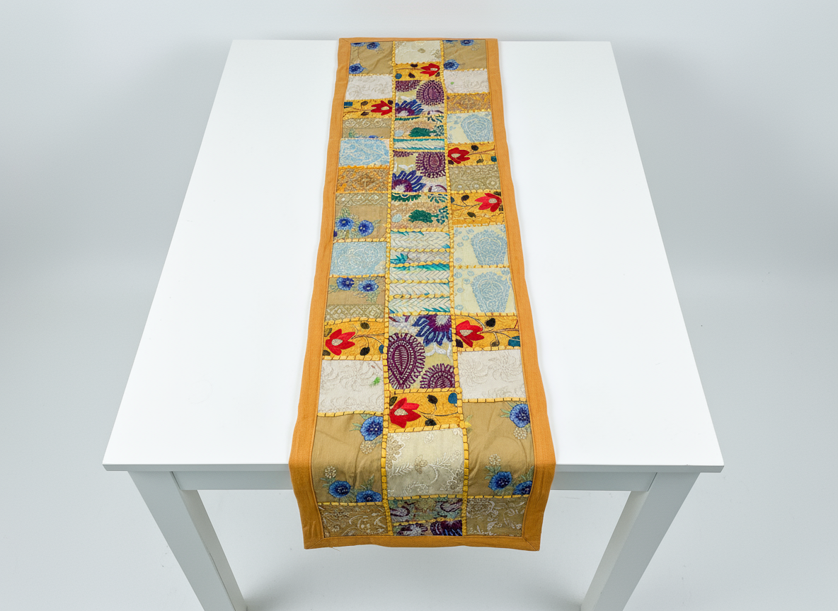 Patchwork table runner on a white table with a white background