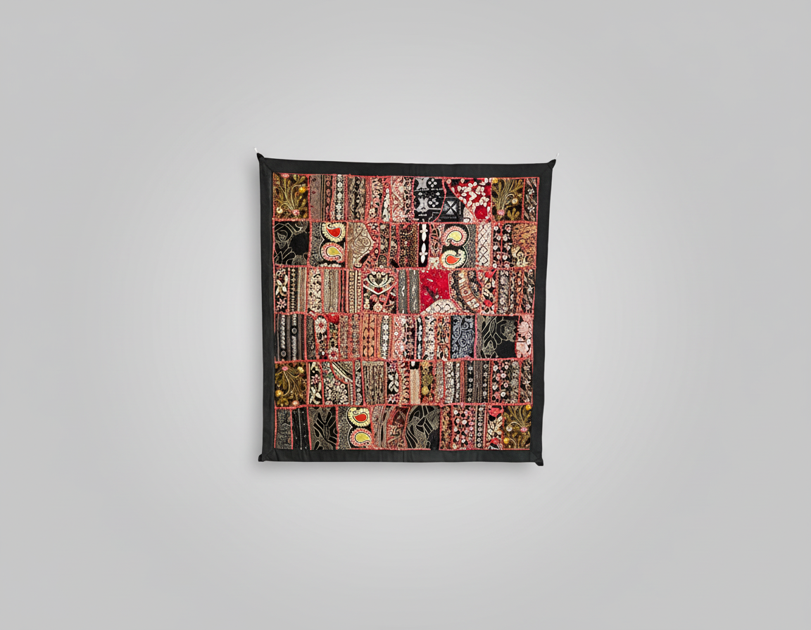 Textile artwork with various patterns and colors on a gray background