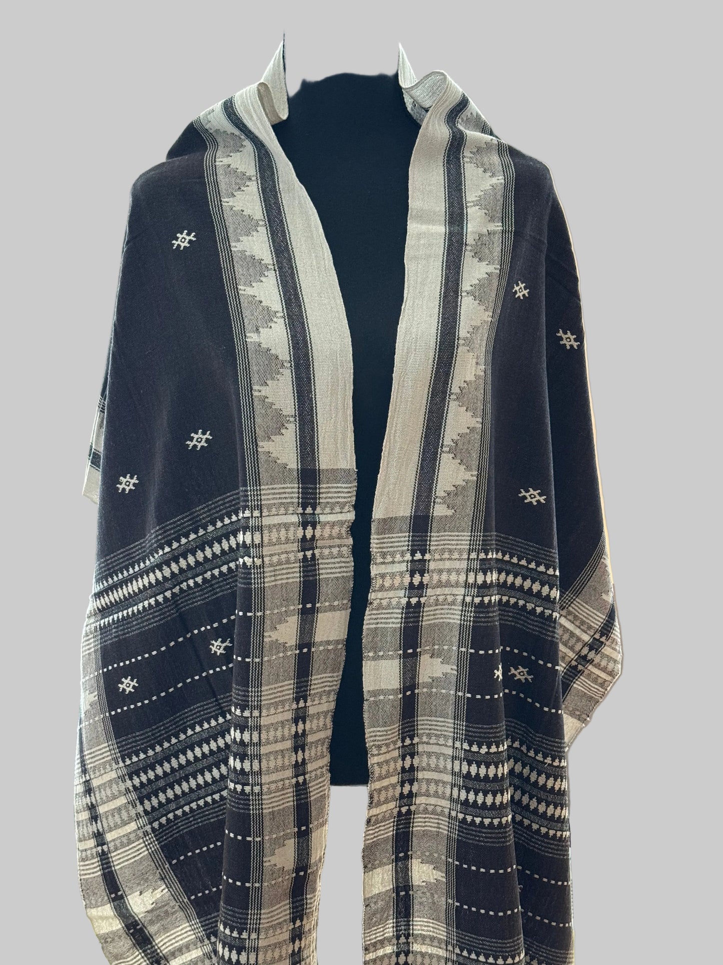 Blue and white patterned Kotpad weave stole on a mannequin against a neutral background