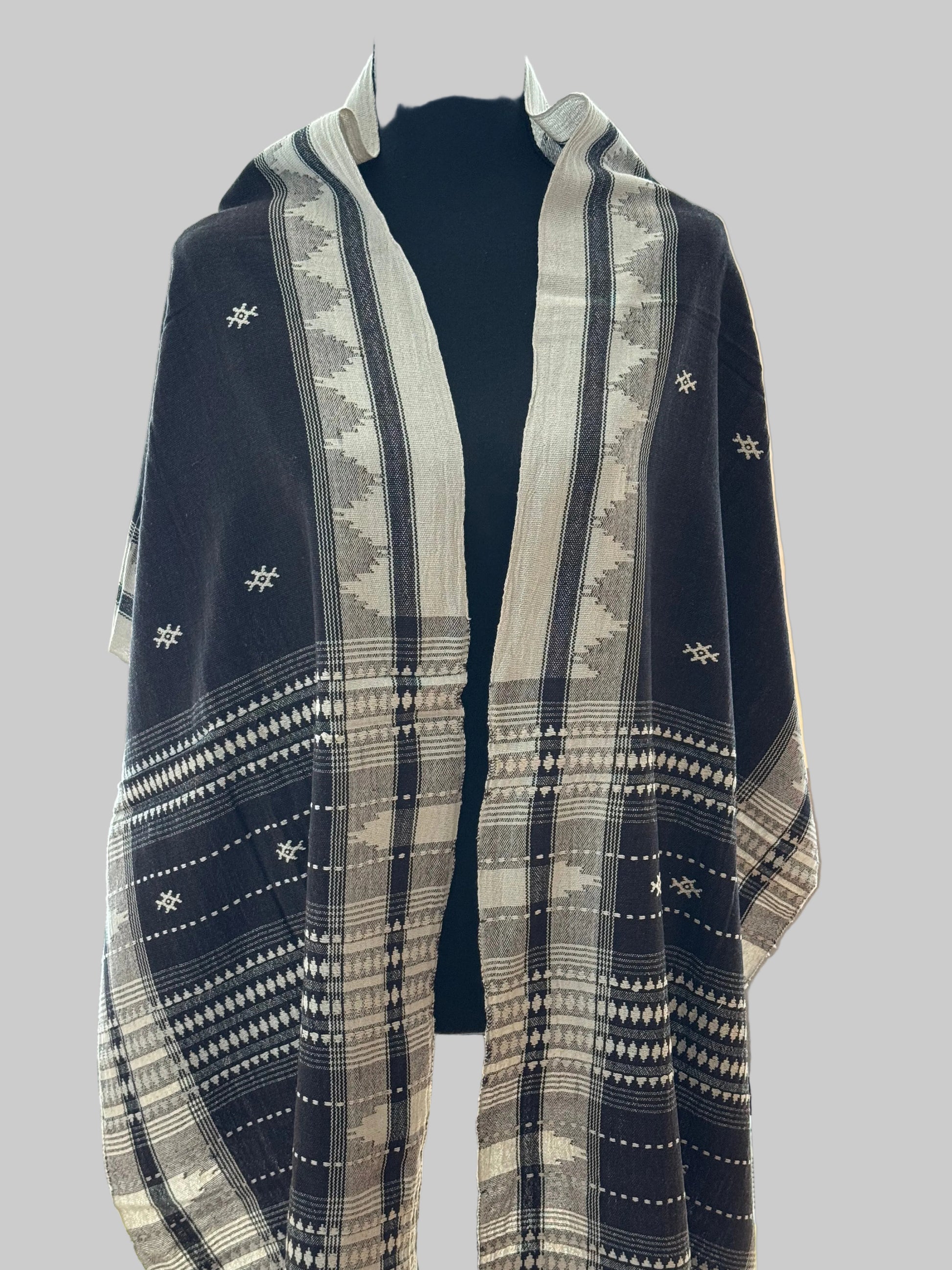 Blue and white patterned Kotpad weave stole on a mannequin against a neutral background