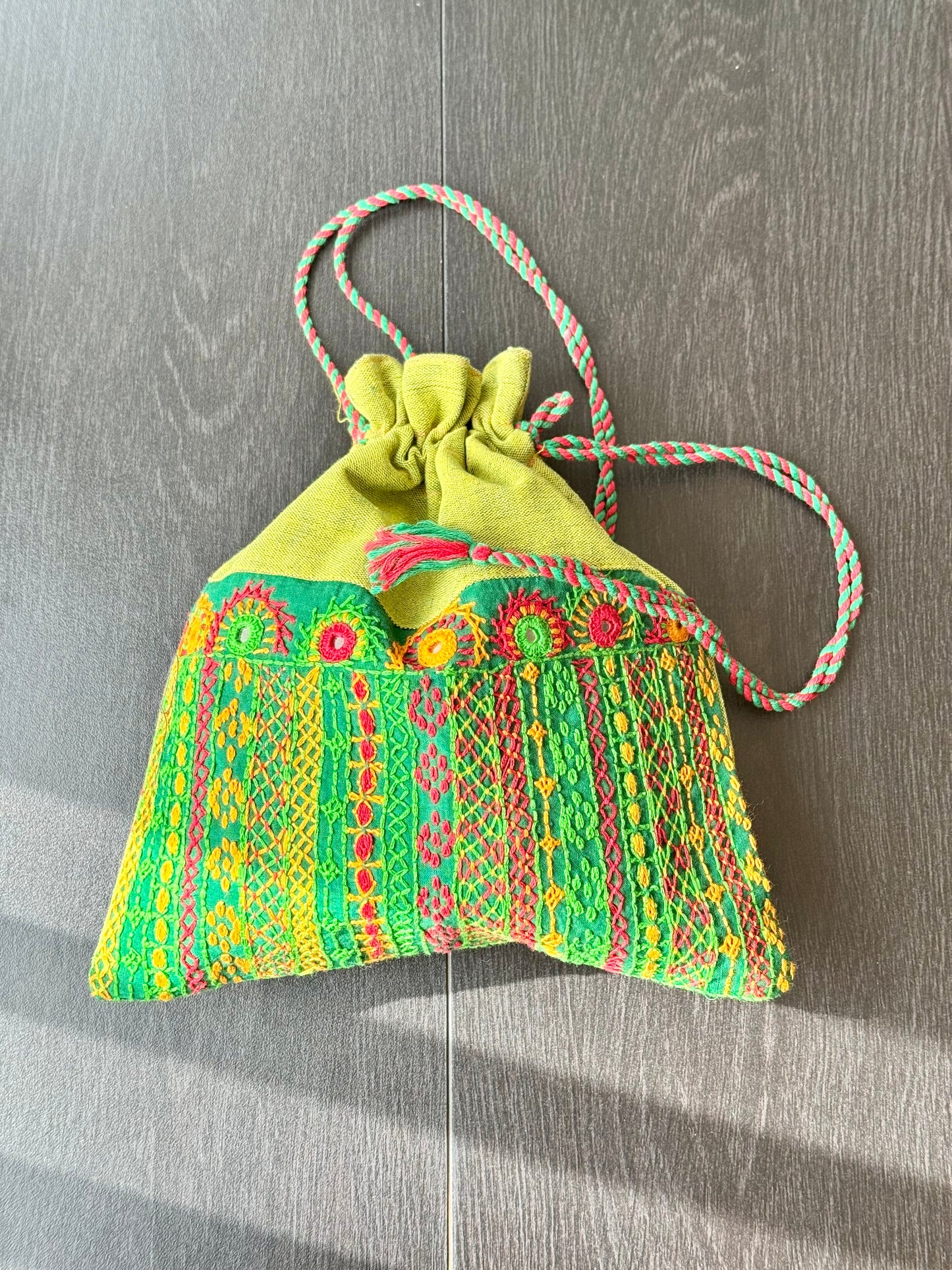 Green bag with intricate Lambani embroidery work