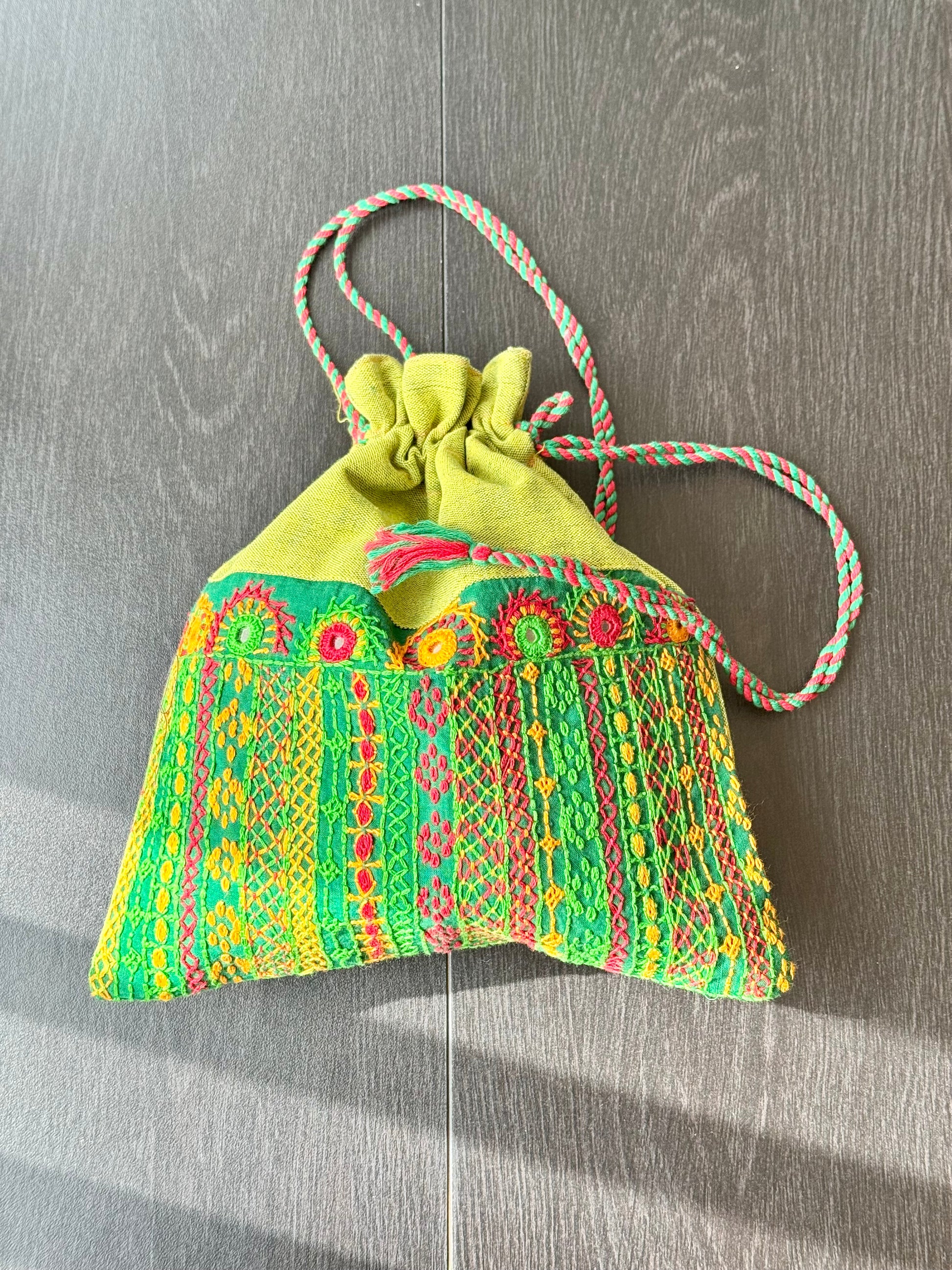 Green bag with intricate Lambani embroidery work