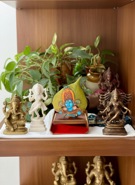 Decorative shelf with statues and plants on a wooden surface