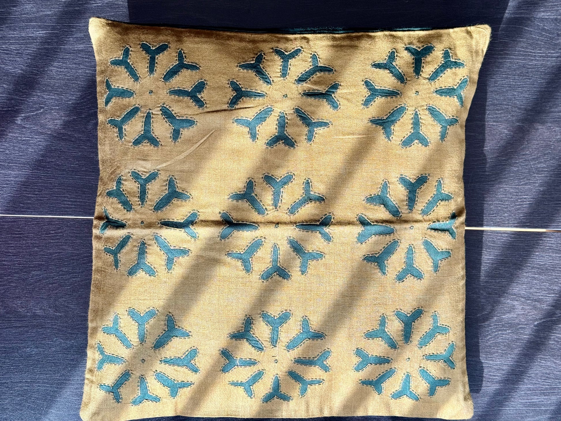 Handcrafted Appliqué work on cushion covers, showcasing vibrant designs and intricate stitching. A beautiful fusion of traditional craftsmanship and modern style, adding a unique touch to your living space.