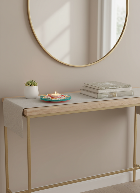 Console table with decorative items against a beige wall