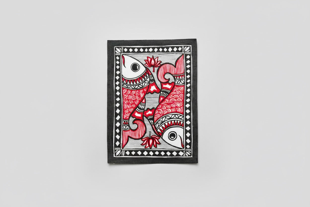 Madhubani art painting with red and black fish design on a gray background