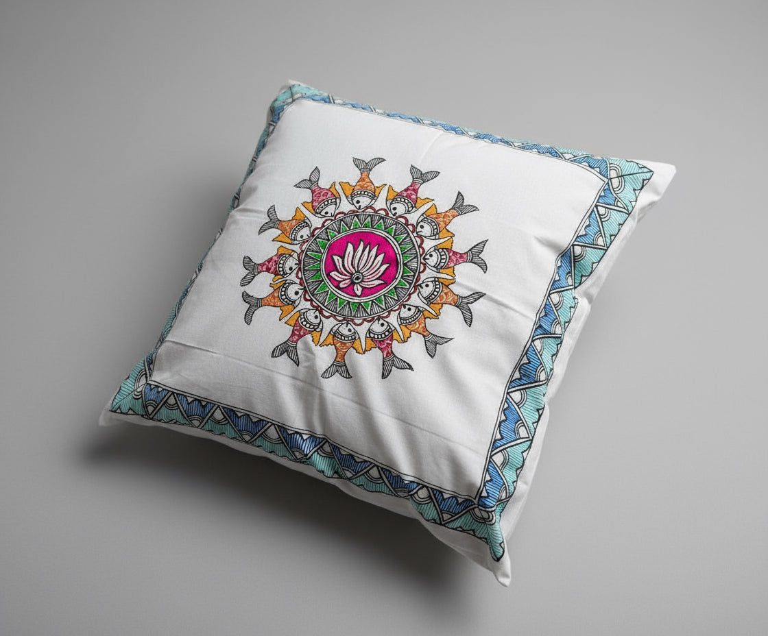 Decorative pillow with colorful Madhubani art design on a textured surface